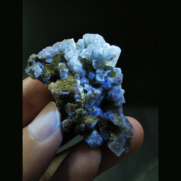 Yellow-green fluorite on calcite plates — detail view