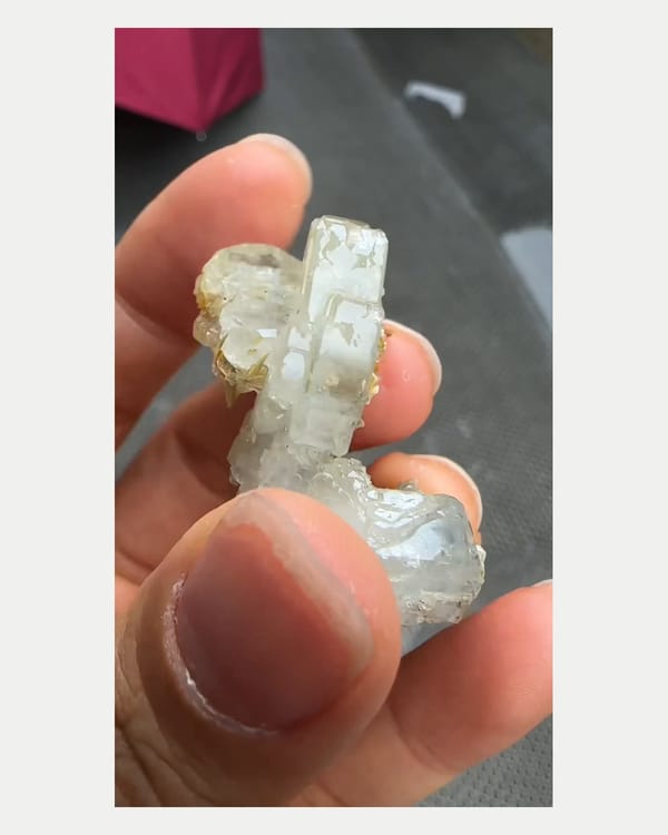 Complete clean front view of pale Xuebaoding aquamarine with mica