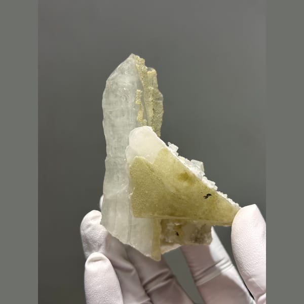 Pale yellow-green fluorite with a quartz point from Daguishan — alternate view
