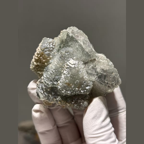 Grey-green fluorite with stepped terraced faces from Hunan — complete view