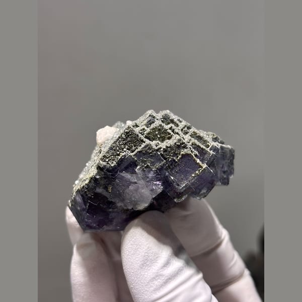 Purple fluorite cube with grey stepped growth from Yaogangxian — complete view
