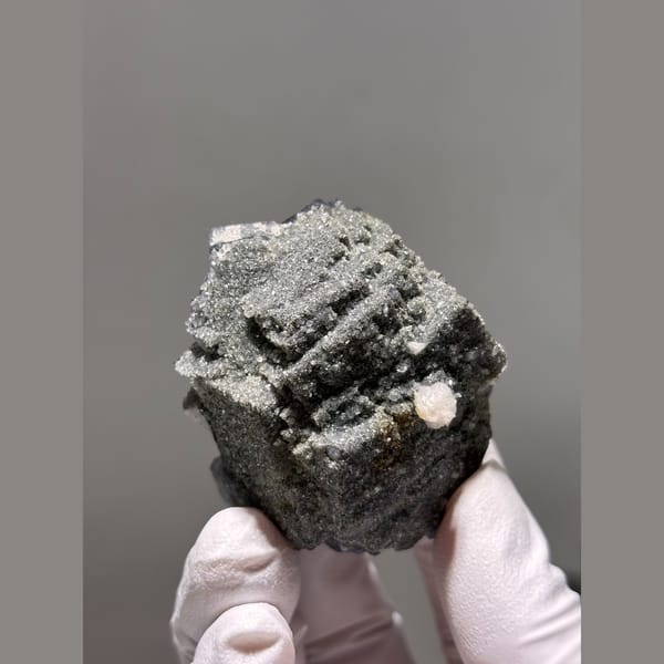 Purple fluorite cube with grey stepped growth from Yaogangxian — detail view