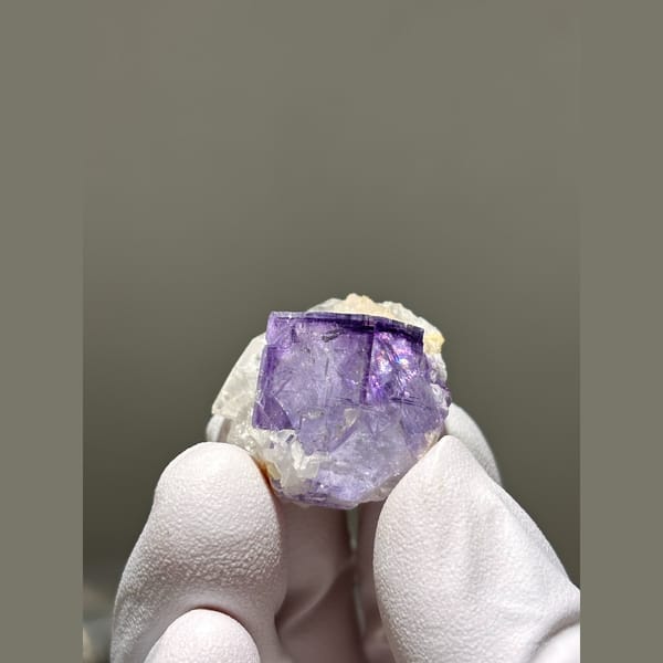 Vivid purple fluorite cube with quartz from Yaogangxian — complete view