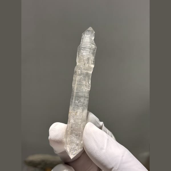 Long slender double terminated quartz crystal from Yunnan — alternate view