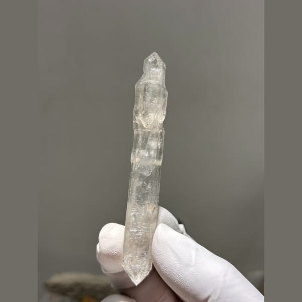 Long slender double terminated quartz crystal from Yunnan — alternate view