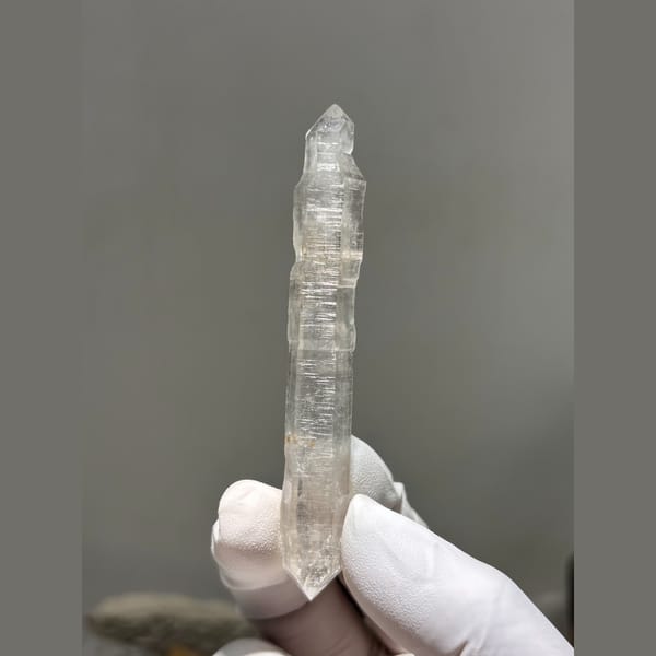 Long slender double terminated quartz crystal from Yunnan — detail view
