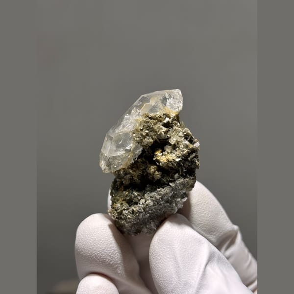 Clear quartz point on mica matrix from Xuebaoding — alternate view