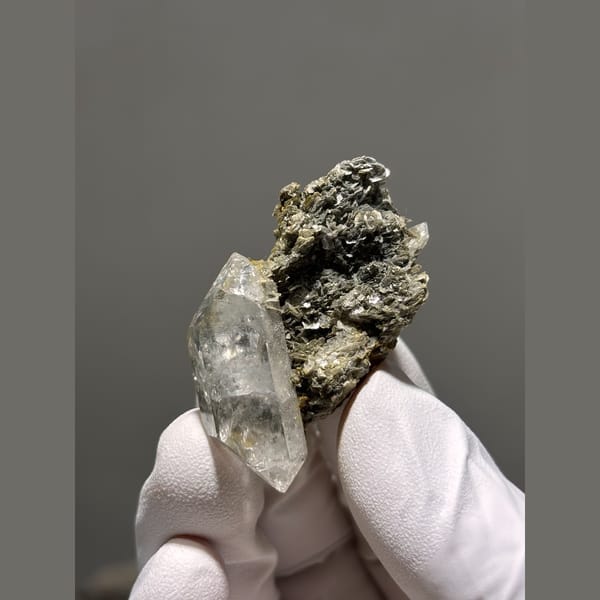 Clear quartz point on mica matrix from Xuebaoding — alternate view