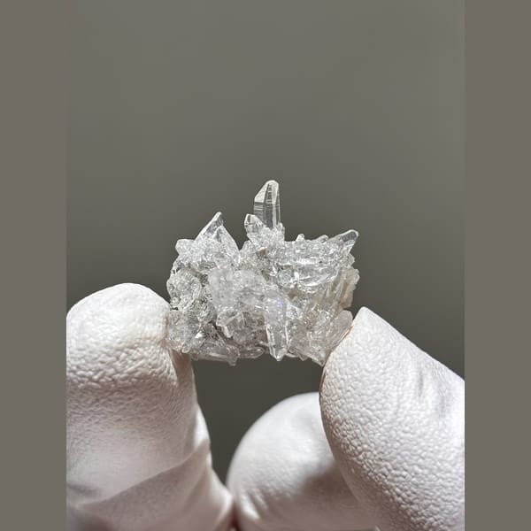 Tiny cluster of clear quartz points from Jinkouhe — alternate view