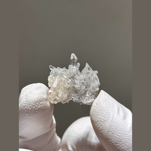Tiny cluster of clear quartz points from Jinkouhe — alternate view