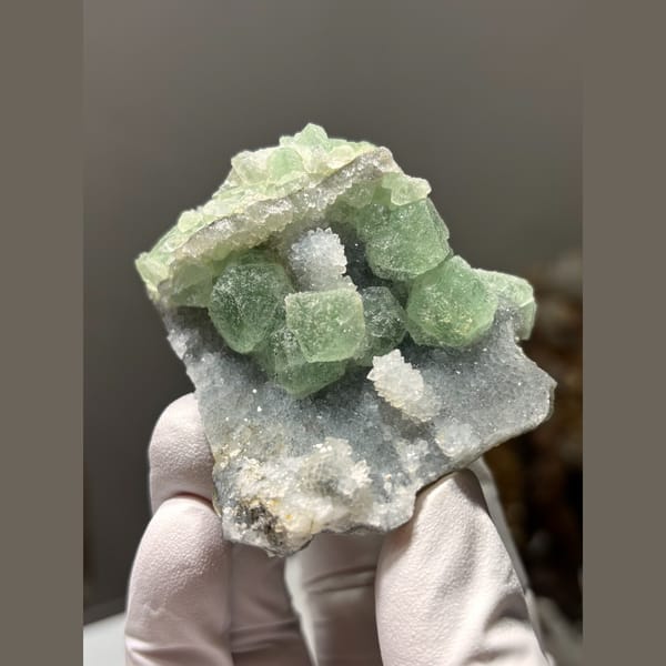 Green fluorite cubes on druzy quartz from Fujian — alternate view