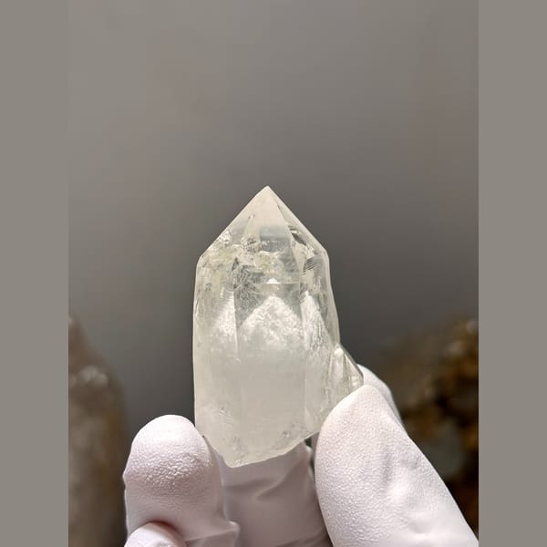 Clear quartz point with white dolomite inclusions from Yaogangxian — alternate view