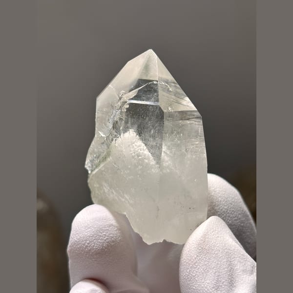 Clear quartz point with white dolomite inclusions from Yaogangxian — alternate view