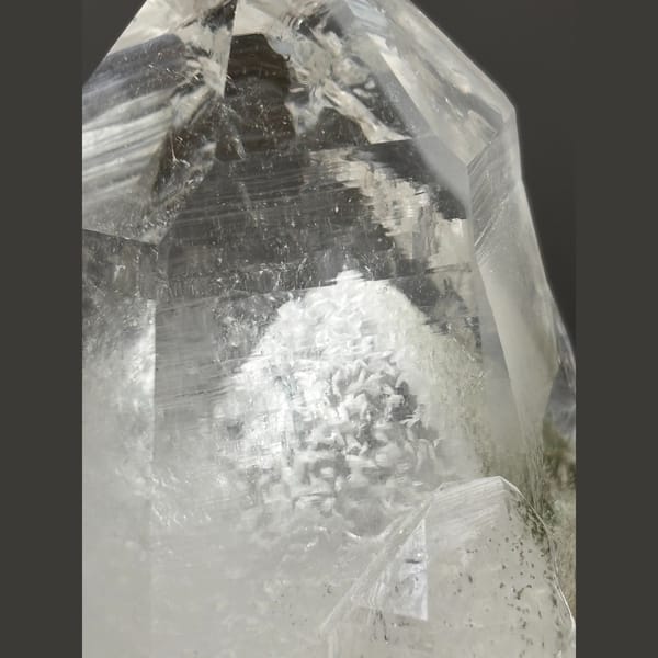Clear quartz point with white dolomite inclusions from Yaogangxian — detail view