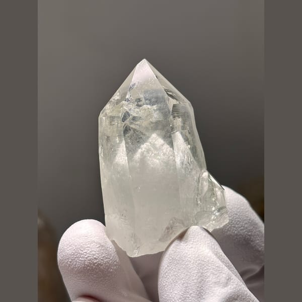 Clear quartz point with white dolomite inclusions from Yaogangxian — detail view