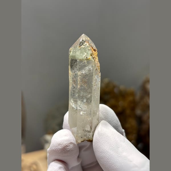 Clear quartz point floater with intact tip from Xuebaoding — complete view