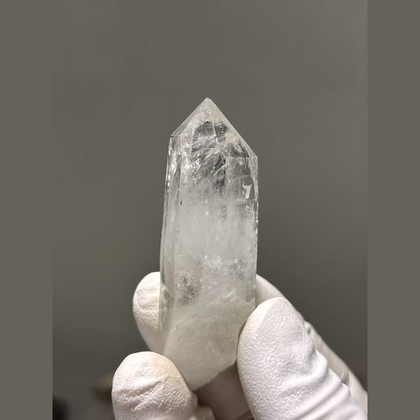 Clear quartz point from Xuebaoding — complete view