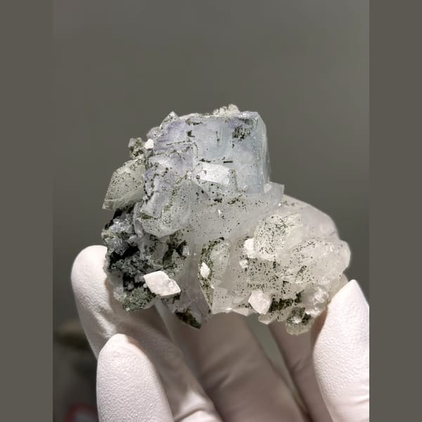 Pale blue fluorite with quartz and calcite from Yaogangxian — detail view