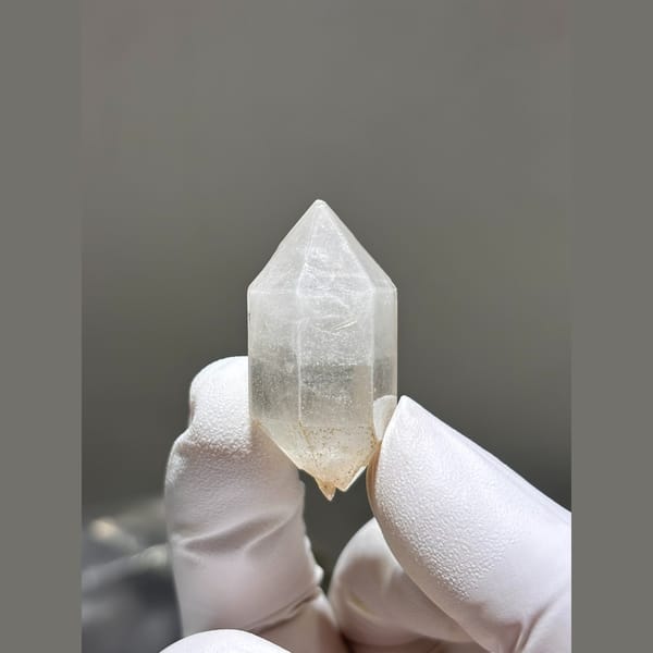 Double terminated quartz crystal with faint inclusions from Yunnan — complete view