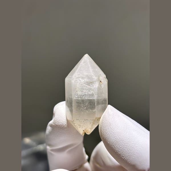 Double terminated quartz crystal with faint inclusions from Yunnan — alternate view