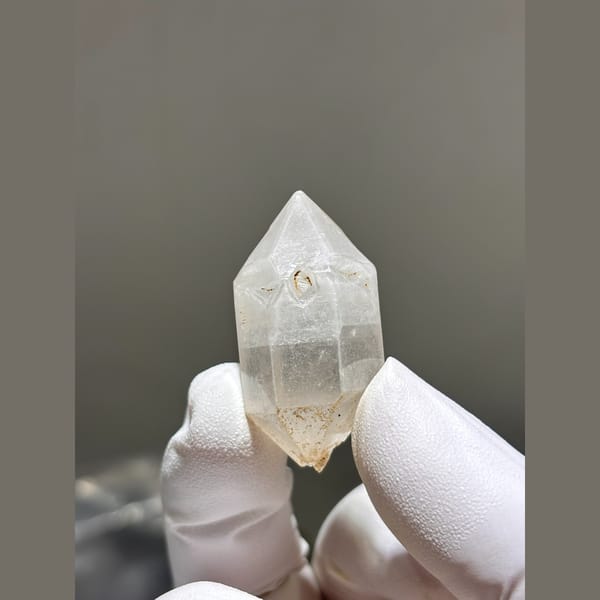 Double terminated quartz crystal with faint inclusions from Yunnan — detail view