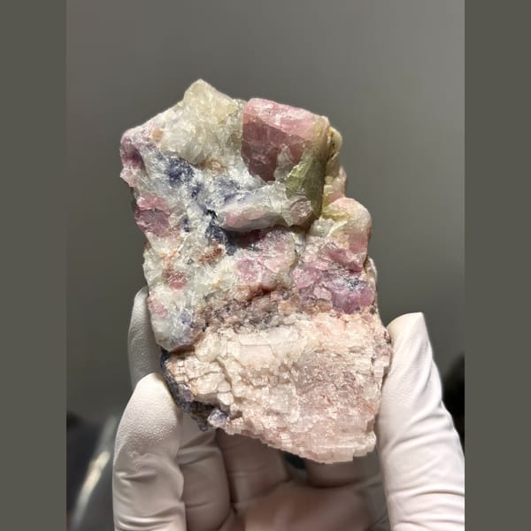 Pink and green tourmaline crystals in pale pink matrix from Brazil — complete view
