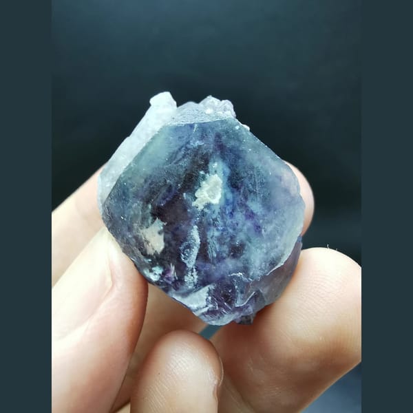 Clear blue-purple fluorite crystal — complete view