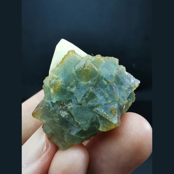 Octahedral blue-green fluorite on candle quartz — complete view