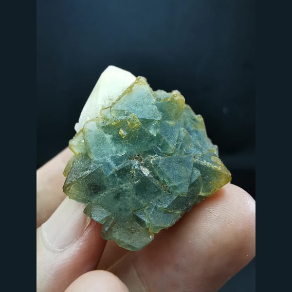 Octahedral blue-green fluorite on candle quartz — alternate view
