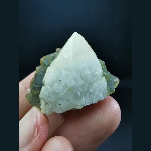 Octahedral blue-green fluorite on candle quartz — detail view
