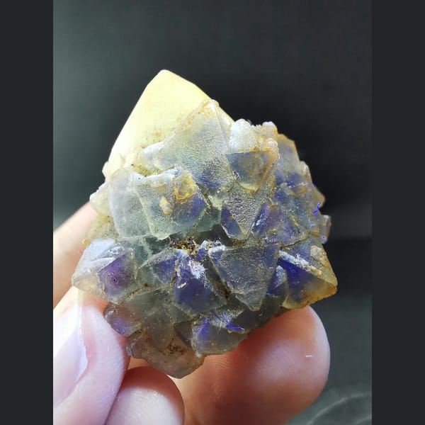 Octahedral blue-green fluorite on candle quartz — detail view