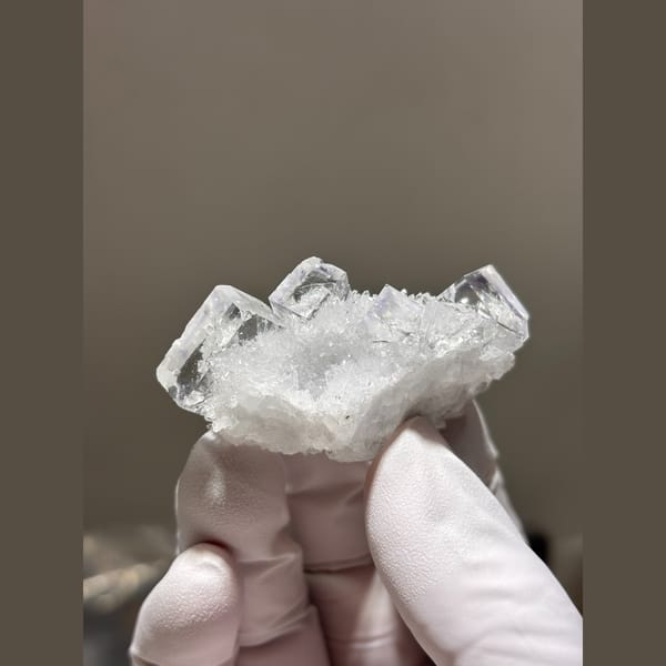 Glassy near-colourless cubic fluorite with quartz from Zhejiang — alternate view