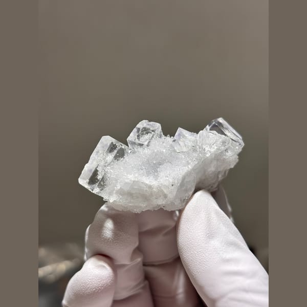 Glassy near-colourless cubic fluorite with quartz from Zhejiang — alternate view