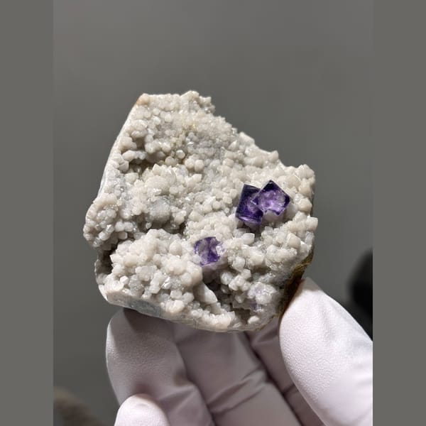 Deep purple fluorite cubes on white quartz druse from Inner Mongolia — alternate view