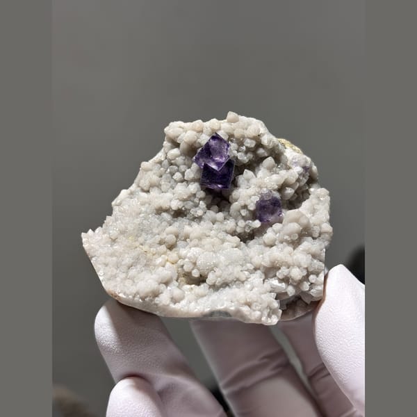 Deep purple fluorite cubes on white quartz druse from Inner Mongolia — alternate view