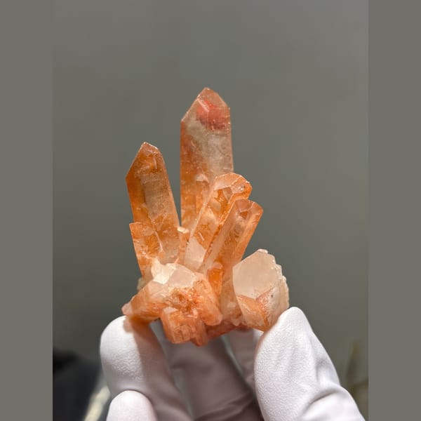 Cluster of orange-red quartz points from Madagascar — alternate view