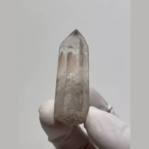 Light smoky double-terminated quartz floater from Jinkouhe, Sichuan — complete view