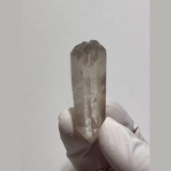 Light smoky double-terminated quartz floater from Jinkouhe, Sichuan — alternate view