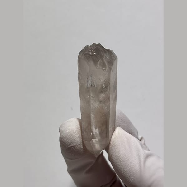 Light smoky double-terminated quartz floater from Jinkouhe, Sichuan — alternate view