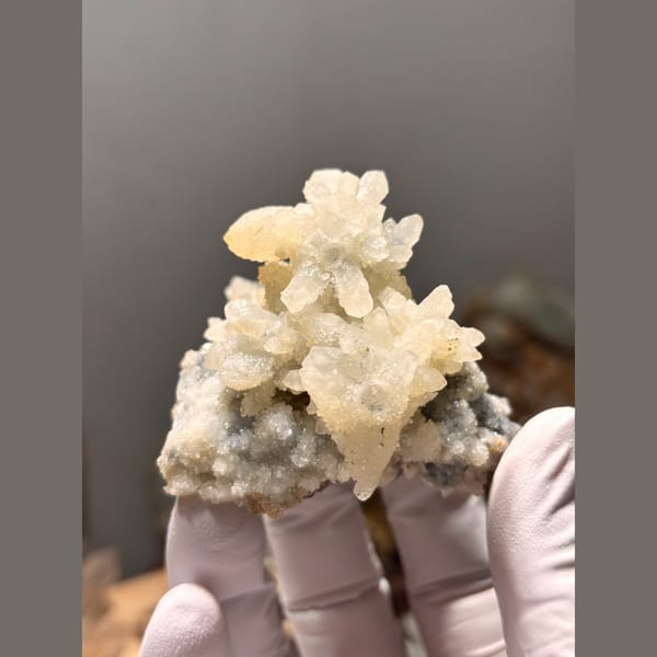 Cluster of creamy quartz with sparkling sugary faces from Guizhou — complete view