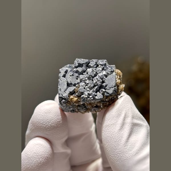 Grey metallic cubic galena with calcite — complete view