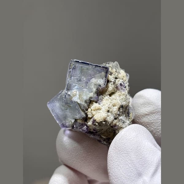 Glassy blue-purple fluorite cube on matrix from Yaogangxian, Hunan — alternate view