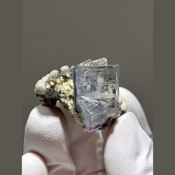 Glassy blue-purple fluorite cube on matrix from Yaogangxian, Hunan — alternate view
