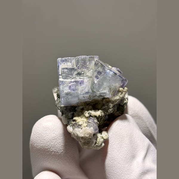 Glassy blue-purple fluorite cube on matrix from Yaogangxian, Hunan — detail view