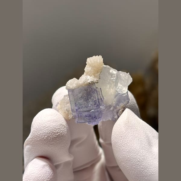 Blue-purple fluorite cubes with pale calcite from Yaogangxian, Hunan — alternate view