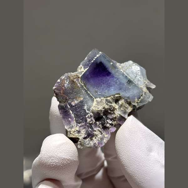 Purple fluorite cubes with deep violet cores from Yaogangxian, Hunan — complete view