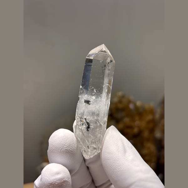 Slender water-clear double-terminated quartz from Jinkouhe, Sichuan — complete view