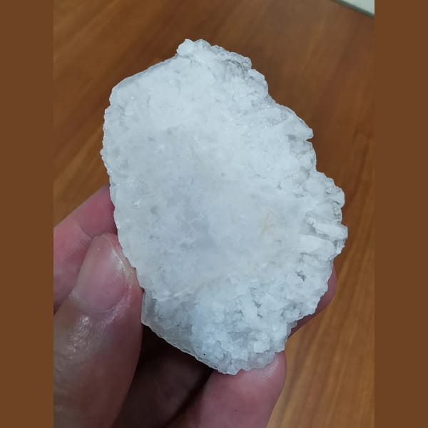 Thin platy calcite with red fluorescence — complete view