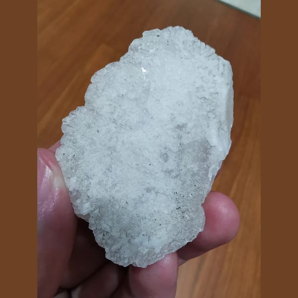 Thin platy calcite with red fluorescence — alternate view
