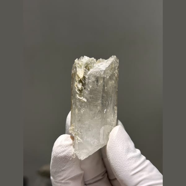 Chunky clear quartz crystal with mica from Xuebaoding, Sichuan — complete view